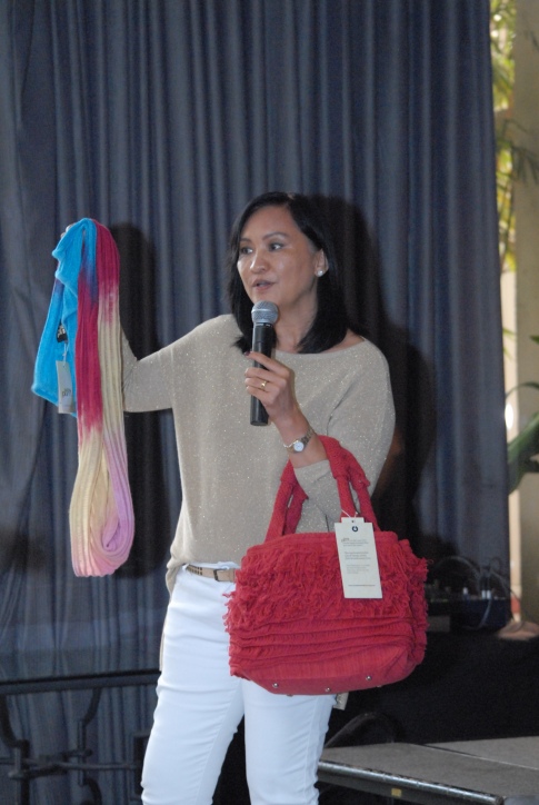 Elsie Standen of Pina by Nooks with shawls and bags made of pina fiber.